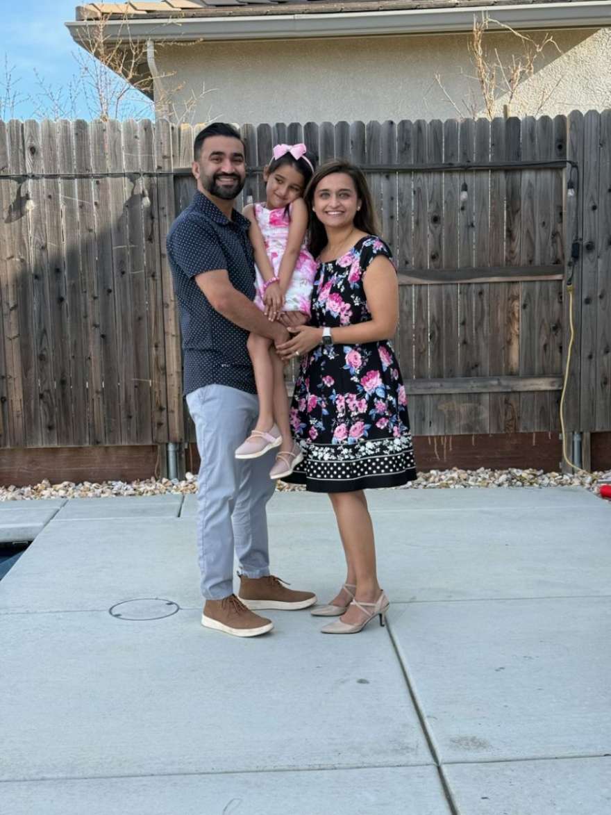 Dewanshi with her family in the backyard