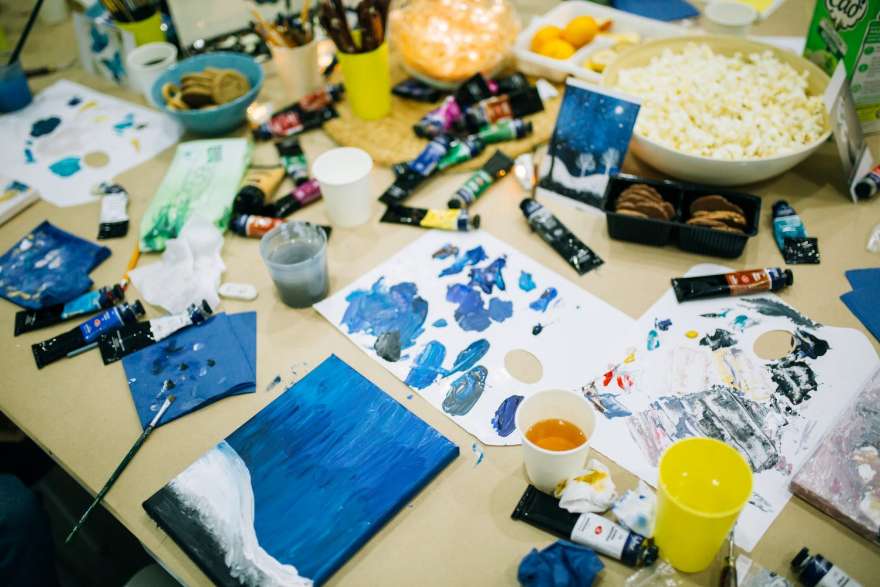 Paints and brushes on the learning table