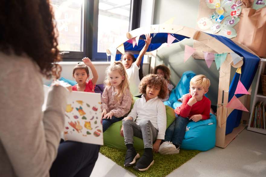 Dewanshi with a child at the learning table